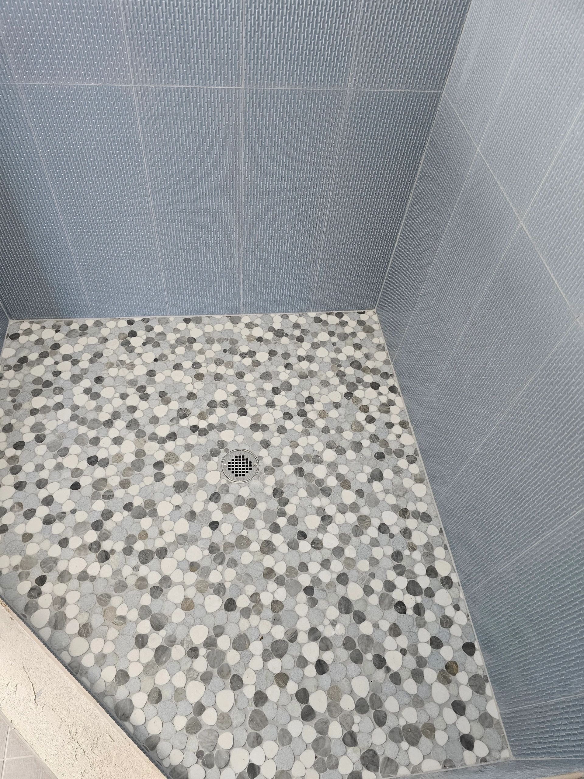Modern bathroom with custom tile walls