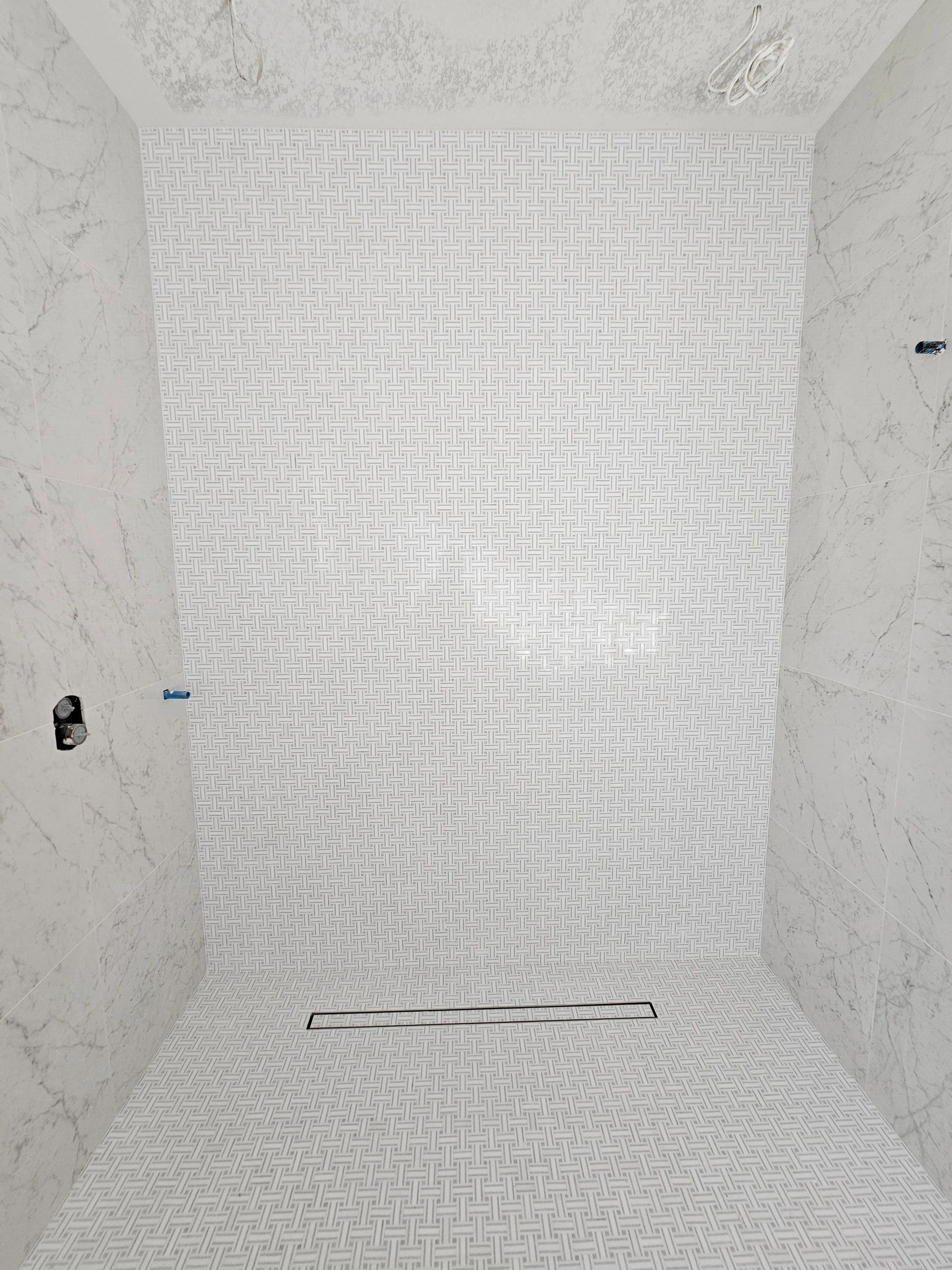 Bathroom with decorative tile walls
